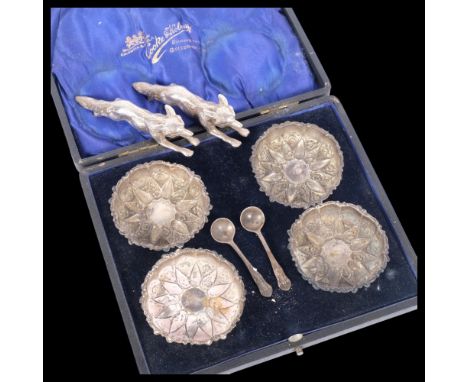 A cased pair of early 20th century salts, embossed decoration, and a pair of silver plated hunting dogs 