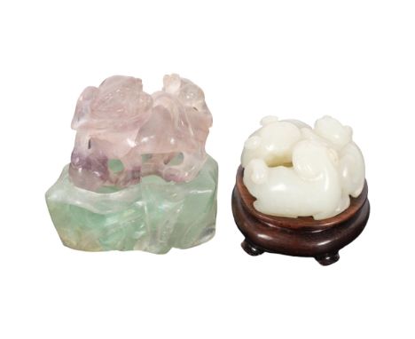 A small Chinese carved jade netsuke, depicting 3 cats on a carved wooden stand, diameter 40mm, and a carved amethyst dog of f