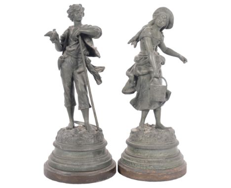 A pair of Vintage spelter country figures - she with a pail and he with a bird, on wooden plinths, H38cm 