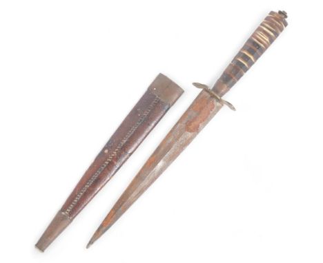 A European 20th century dagger, with octagonal stepped horn handle and brass hilt, blade length 16cm, overall 25cm, with leat