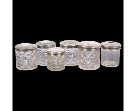 A group of 6 silver-topped dressing table bottles, and a hair tidy 