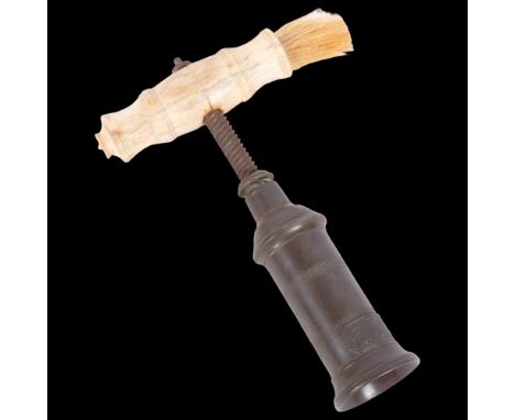 A Victorian Thomason type double-action corkscrew, with brush attached to bone handle 