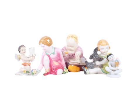 A quimper figure, a Crown Staffordshire kneeling child, a German child with dog, and another, and a Russian seated child, H6.
