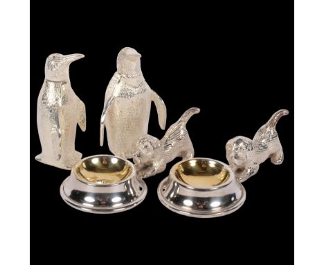 A pair of silver plated penguin design cruets, and a pair of plated salts with dog mounts 