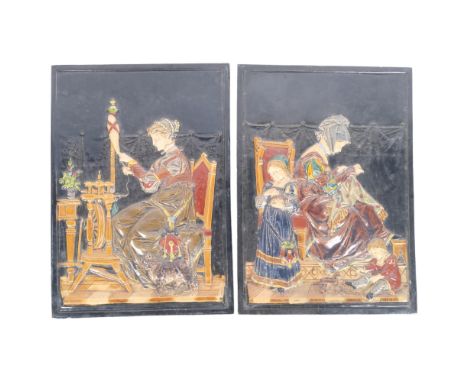 A pair of large Continental Bickweiler embossed tile plaques, depicting Medieval ladies at a spinning wheel and embroidery, H