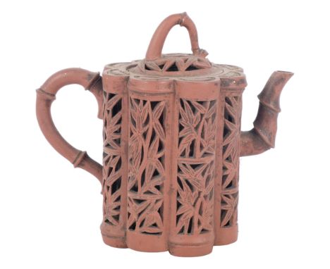 A Chinese Yixing red stoneware reticulated "bamboo" design teapot and lid, H13.5cmGenerally good overall condition, there are