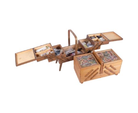 A Vintage cantilever sewing box and contents, L42cm, and a similar modern sewing box with inset panels 