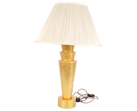 An Art Deco giltwood table lamp, the stepped conical base with pleated shade, in working order, with LED bulb 