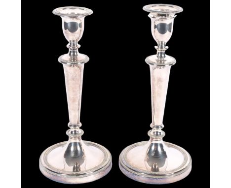 A pair of silver plated candlesticks of tapered form, on circular weighted base, H27.5cm 
