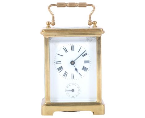 A French brass-cased carriage clock with alarm, height 11cm not including handle, white enamel dial and Roman numeralsThere a