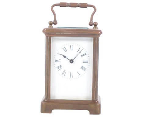 A French brass-cased carriage clock, H11cm not including handle, complete with key, currently in working order 