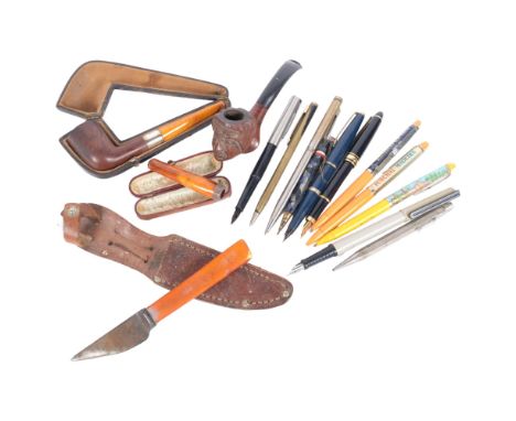 An amber and silver-mounted pipe, various pens, an amber and silver-mounted cheroot holder, knife etc 
