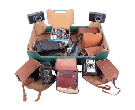 A box of various Vintage cameras, including a Rolleicord, Kodak, various accessories, etc (boxful) 