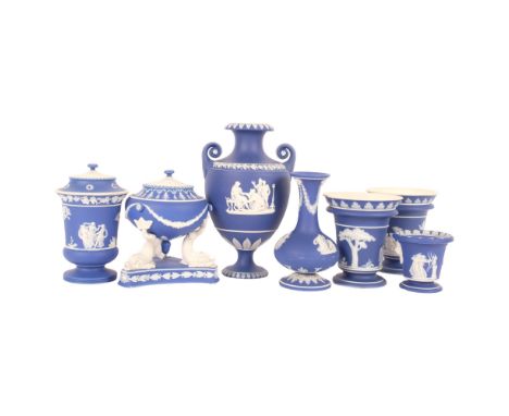 A group of Vintage Wedgwood blue Jasperware, including a pot pourri jar on stand supported by dolphins, a Classical style 2-h