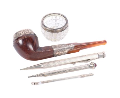 An early 20th century engraved silver-mounted and amber pipe, a silver propelling pencil, a silver swizzle stick, etc 