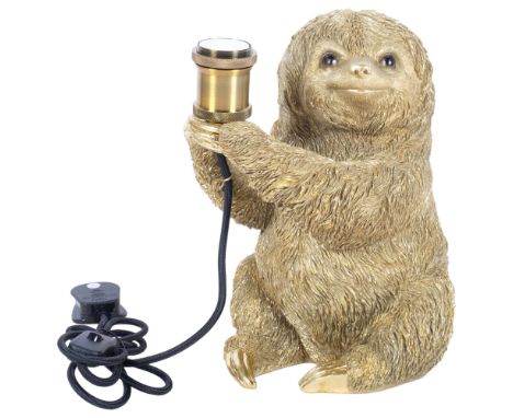A composition table lamp modelled as a gilded sloth, H30cm 