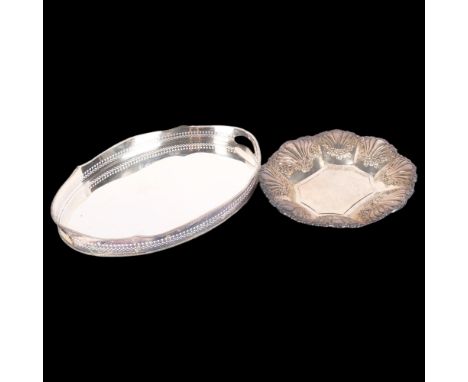 A silver plated oval 2-handled galleried tea tray, W47cm, and a silver plated table centre with repousse rose fluted decorati
