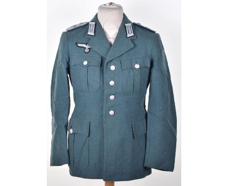 WW2 German Army Officers Tunic; Combat tunic with numbered  buttons and badges. We believe this to be a  post war example sol