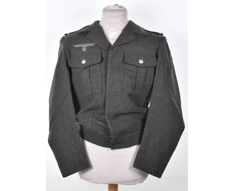 WW2 German Army Tunic; Combat jacket with buttons and badges. We believe this to be a post war example sold as viewed. 