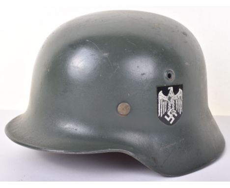 WW2 German  Army M40 Helmet. Original helmet shell with post war double decal  finish and liner with chin strap. Post War Rep