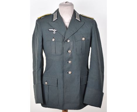 WW2 German Army Officers Tunic. Combat type with buttons and badges, some look original. We believe this to be a post war exa