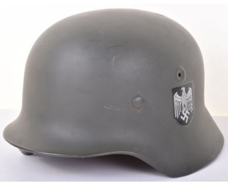 WW2 German Army Helmet; Film prop/ reproduction M40 double decal army helmet with liner and chin strap. Post War Representati