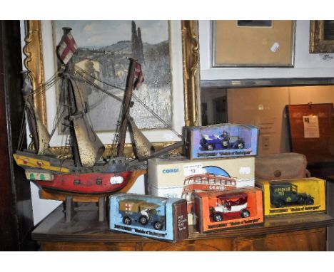 A CORGI SUNBEAM TROLLEY BUS (boxed), similar vehicles, a wooden boat and a box camera