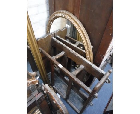 AN OVAL WALL MIRROR in a gilt frame and an oak stick stand (2)