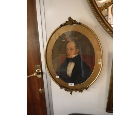 AN EARLY 19TH CENTURY WATERCOLOUR PORTRAIT OF A GENTLEMAN in an oval gilt frame