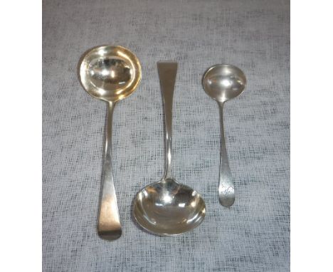 A PAIR OF GEORGE III SILVER SAUCE LADLES and one other smaller ladle (3)