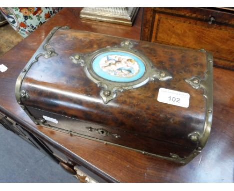 A VICTORIAN FIGURED WALNUT BOX, with central ceramic panel and plated Gothic mounts, 10" wide
