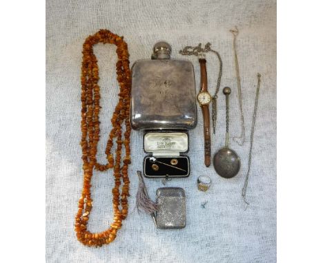 AN EDWARDIAN SILVER PLATED HIP FLASK with engraved initials, a silver vesta case, a rough 'amber' necklace and other items