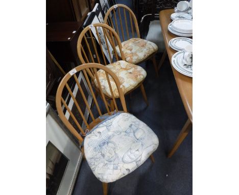 ERCOL;  A SET OF SIX BEECH STICK BACK CHAIRS with pale elm seats