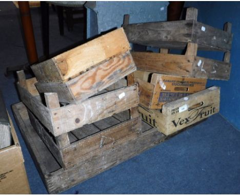 A COLLECTION OF VINTAGE WOODEN FRUIT TRAYS, a camping table, a zinc greenhouse heater and an oil lamp