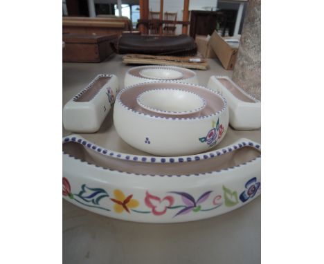 A collection of Poole pottery planters of floral design