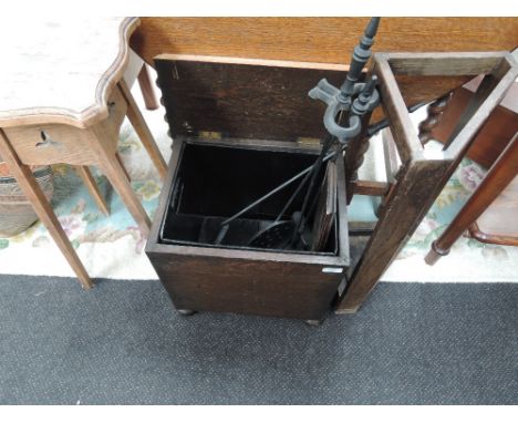 A 1920's oak corner stick stand, a coal box, companion set and an oak plant stand