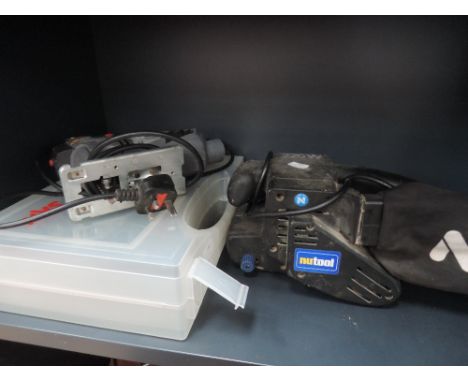 A selection of electric tools including plane