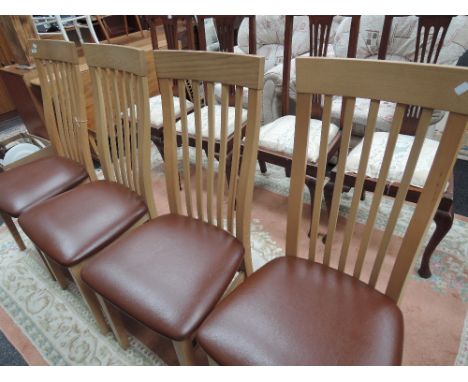 A set of four modern G-Plan light oak kitchen/dining chairs