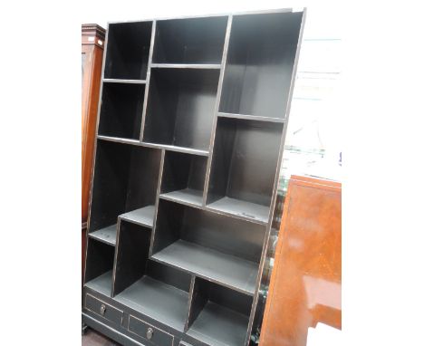 A Japanesque display shelf having three drawers 