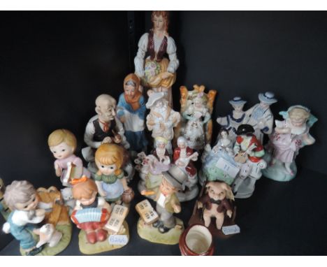 A collection of hummel style ornaments etc