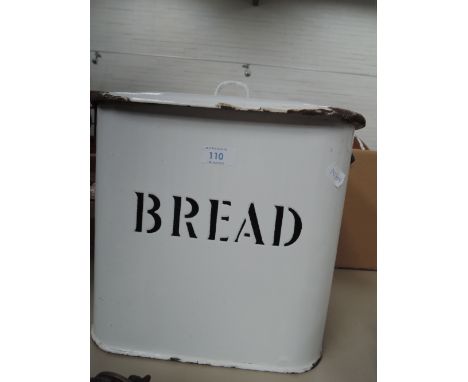 A vintage enamel bread bin