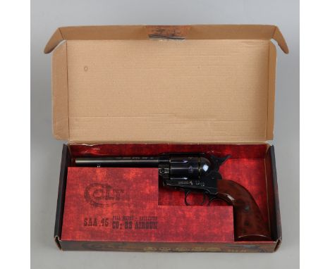 Umarex. Colt Single Action Army 45 CO2 BB Airgun No 15D74085, blued body with brown grip, plus box with instructions.