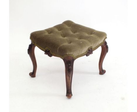 A Victorian green button upholstered stool hipped floral carved mahogany supports 