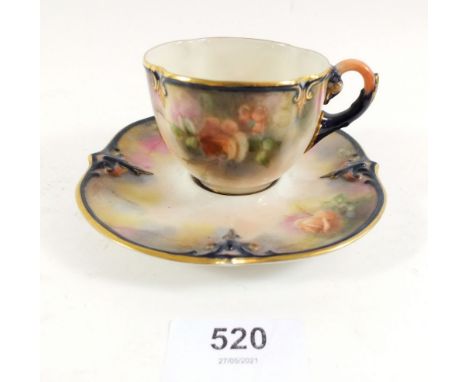 A Hadleys Worcester porcelain tea cup and saucer decorated roses 