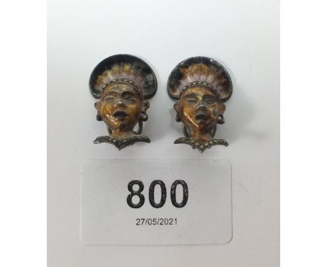 A pair of unusual Art Deco enamel and marcasite earrings in the form of South American Inca heads 