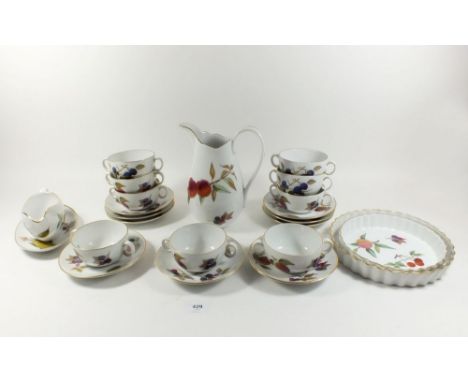 A group of Worcester Evesham oven to table ware to include nine soup bowls and stands, two flan dishes, jug, sauce boat etc. 