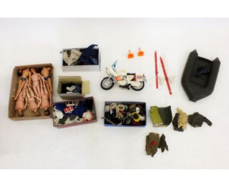 A box of vintage Action Man figures together with clothing and accessories plus an assault dingy and Yamaha police motorcycle