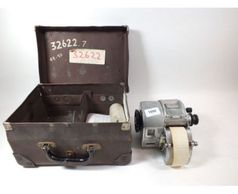 A Gibson vintage bus ticket machine in case