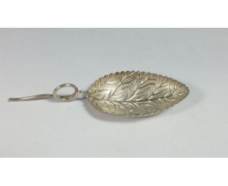 A silver Georgian leaf caddy spoon stamped with duty mark circa 1810 