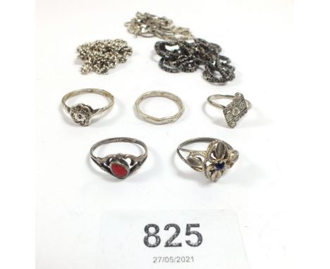 A selection of silver chain necklaces and silver rings 